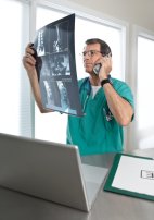 Doctor on phone looking at X-Ray